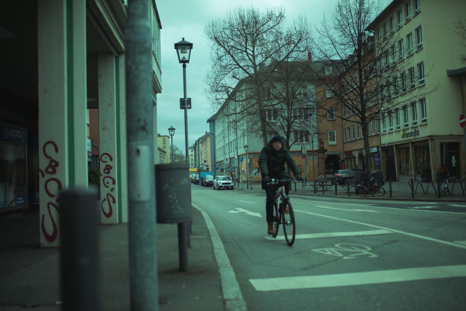 A cyclist in a bike lane on a winter day