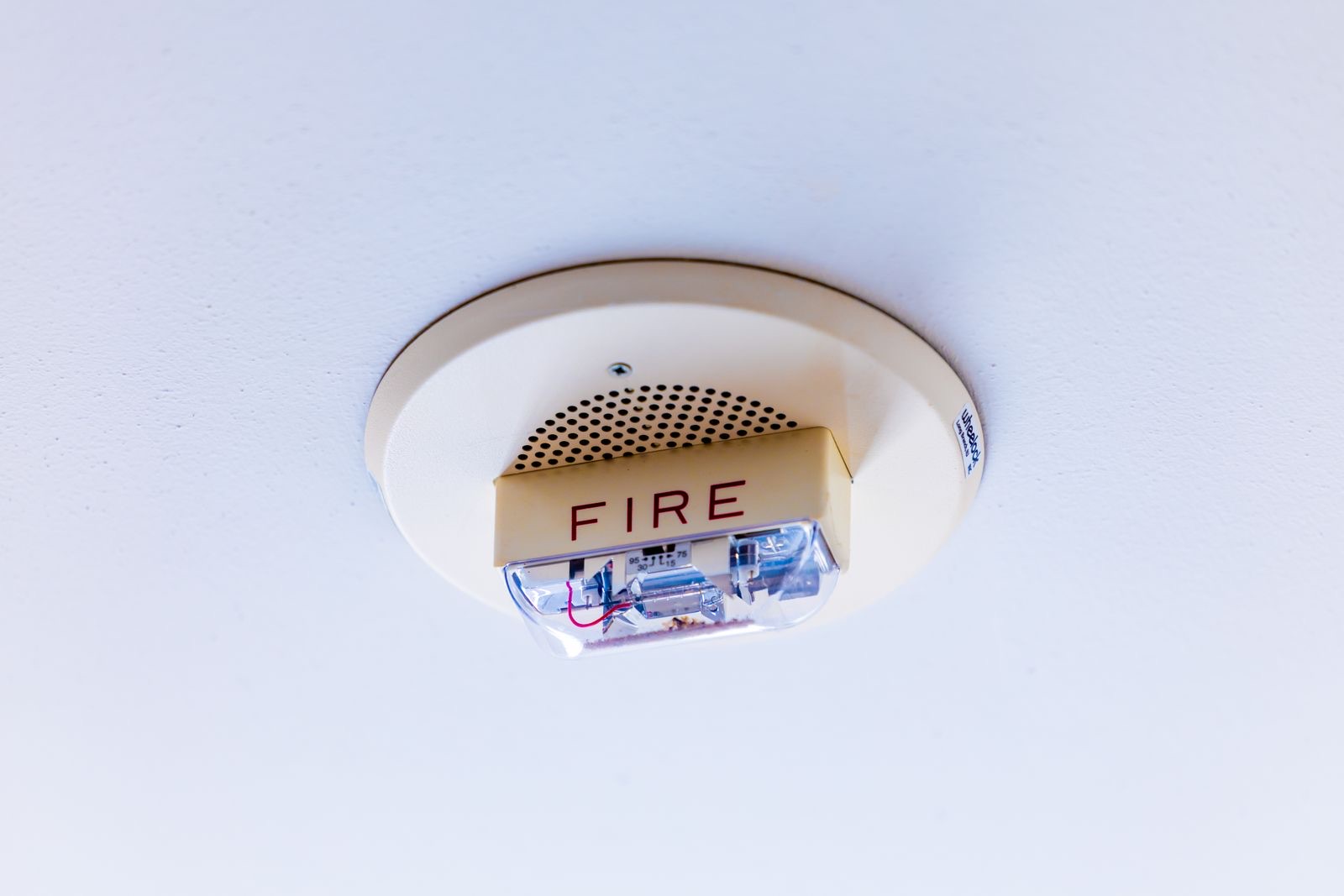 A fire alarm on a ceiling