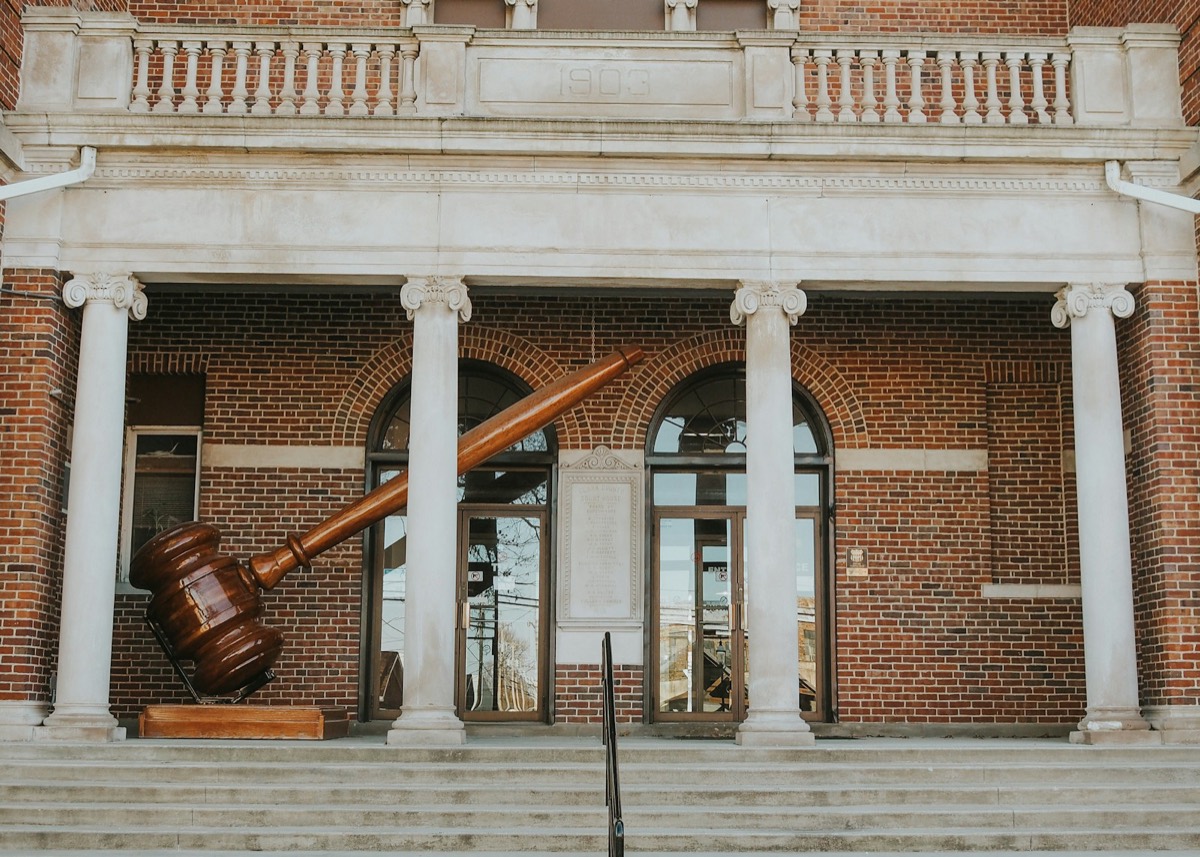 A large wooden object sitting in front of a building