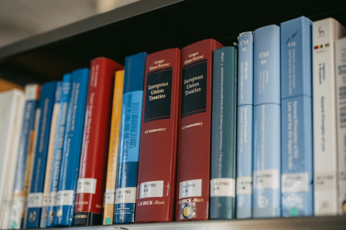 Books are neatly arranged on a bookshelf