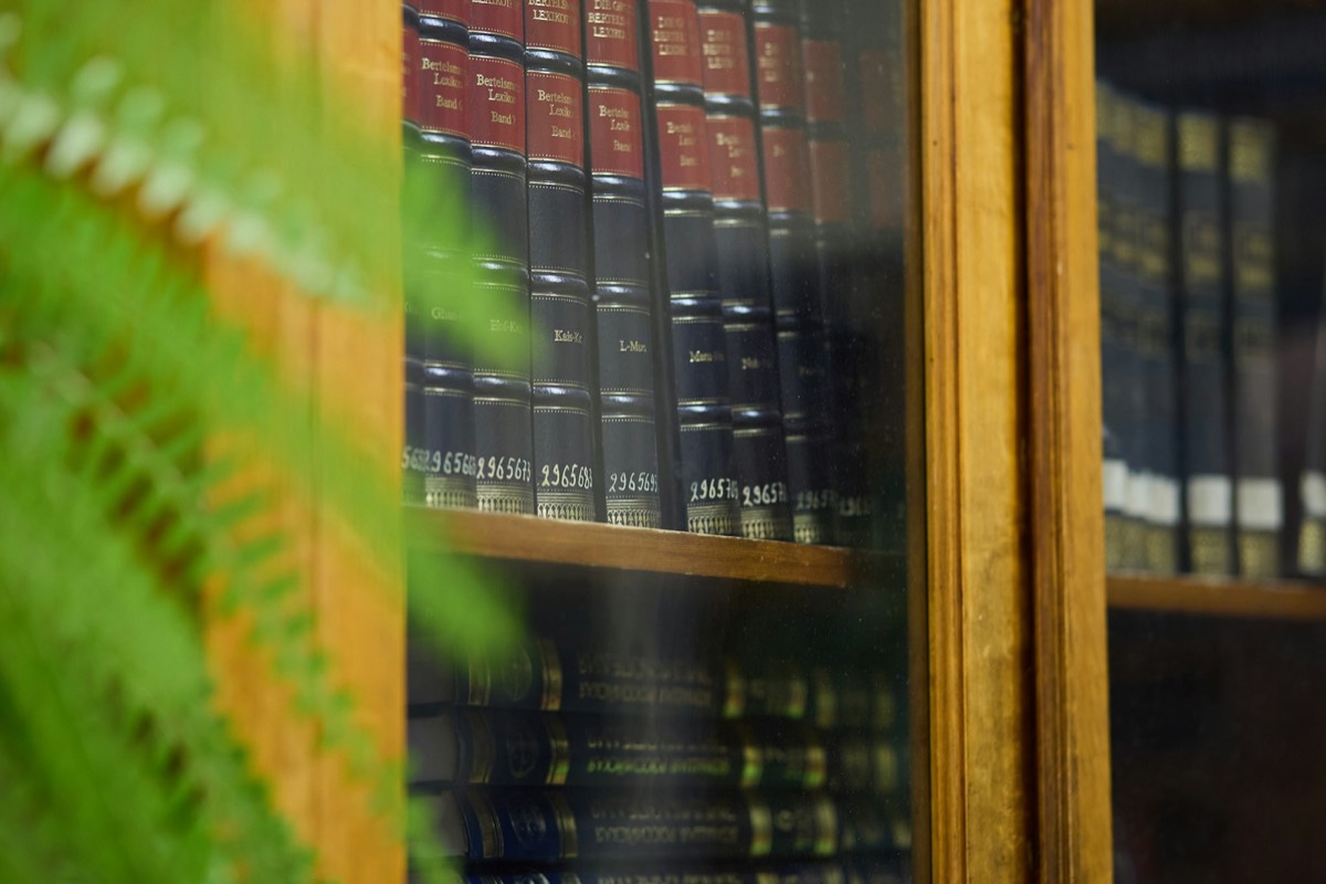 Bookshelves filled with old books in a library