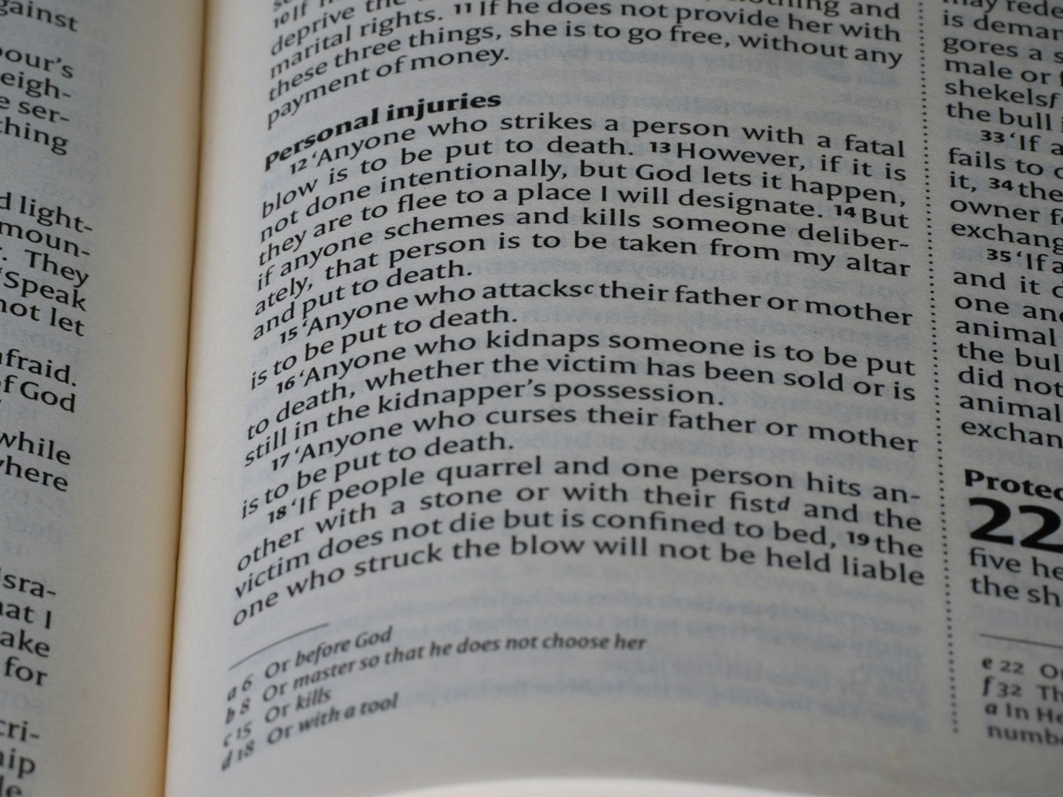 Close-up of an open book with text on pages