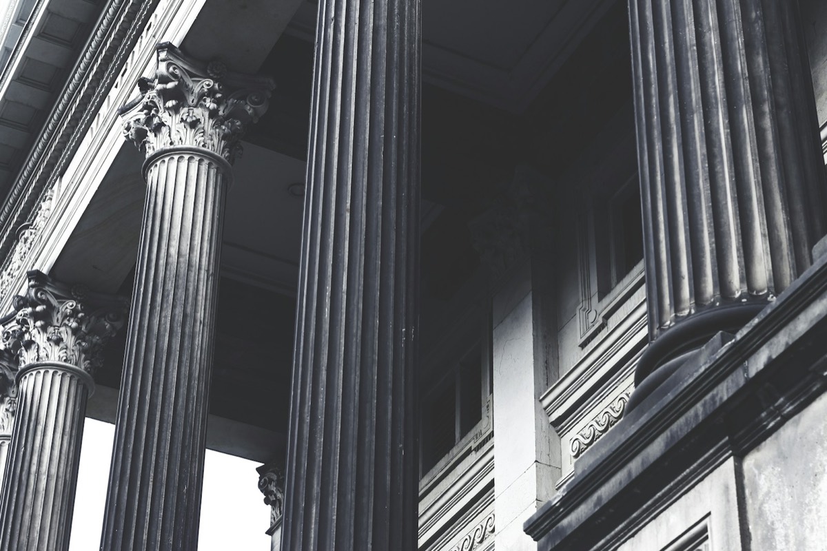 grayscale photo of concrete pillars