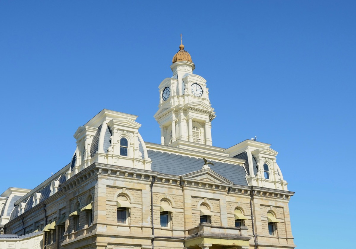 Historic building with a clock tower against blue sky