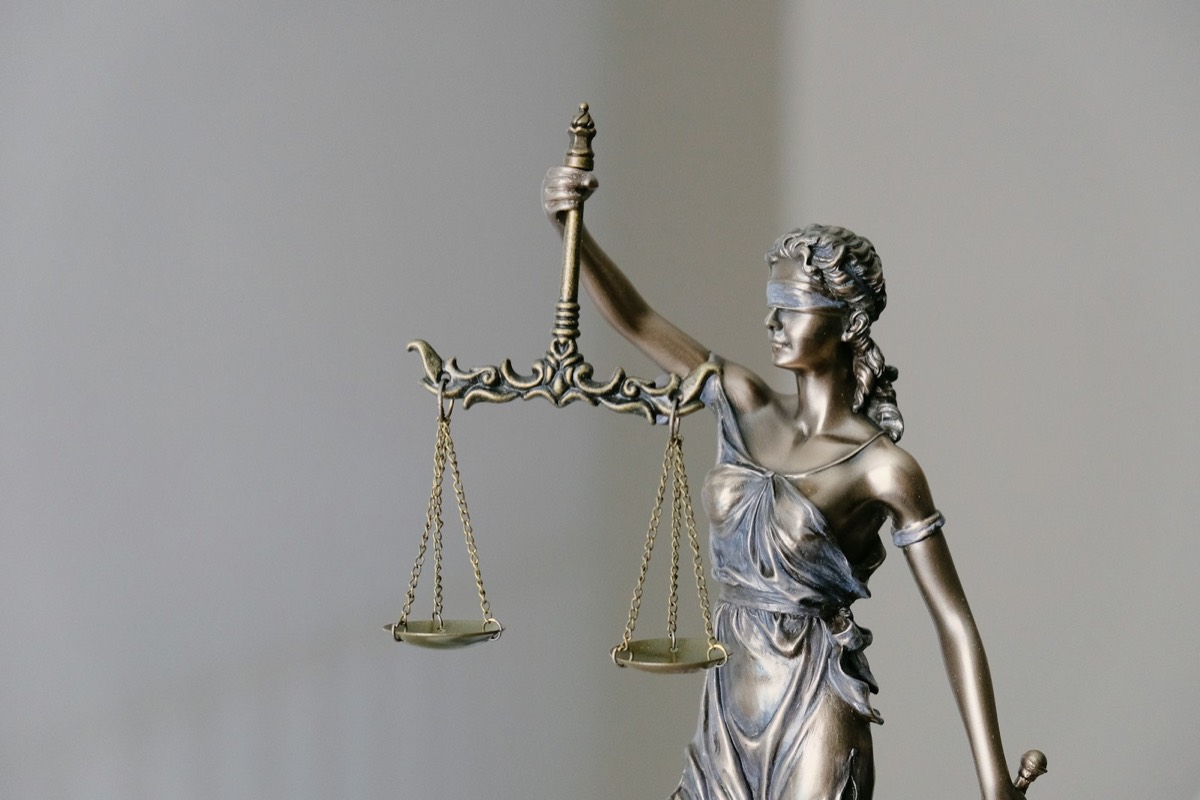 lady justice statue with scales and sword