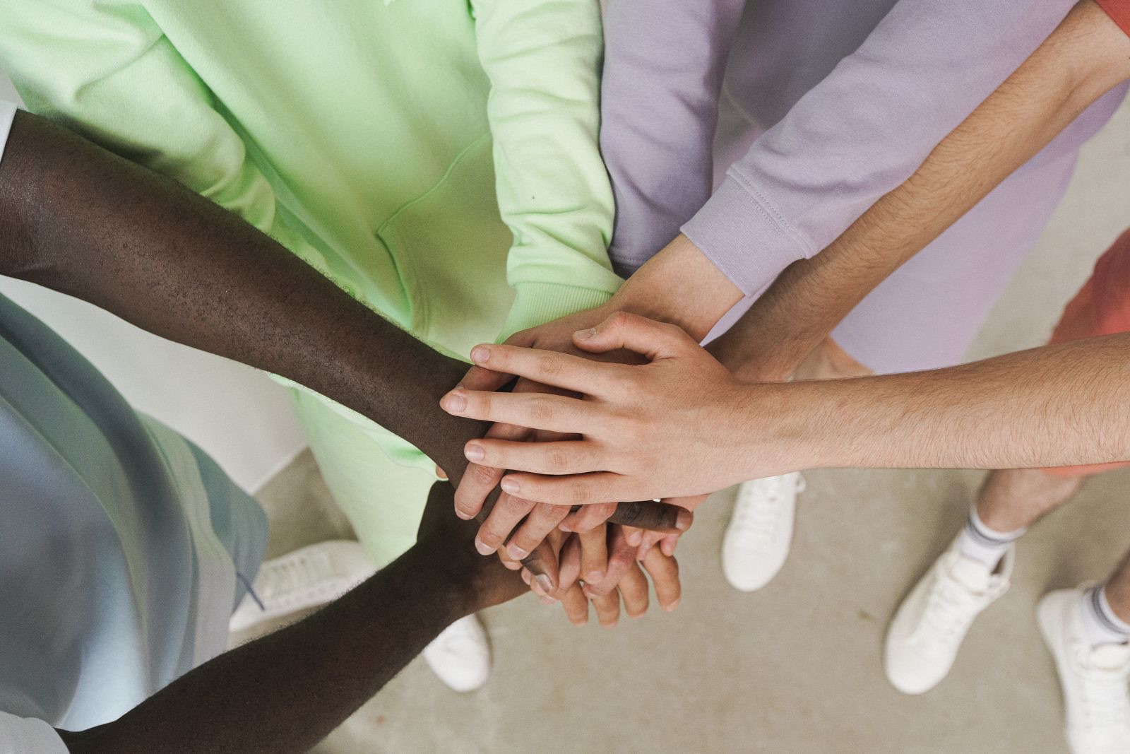 Many hands joined together