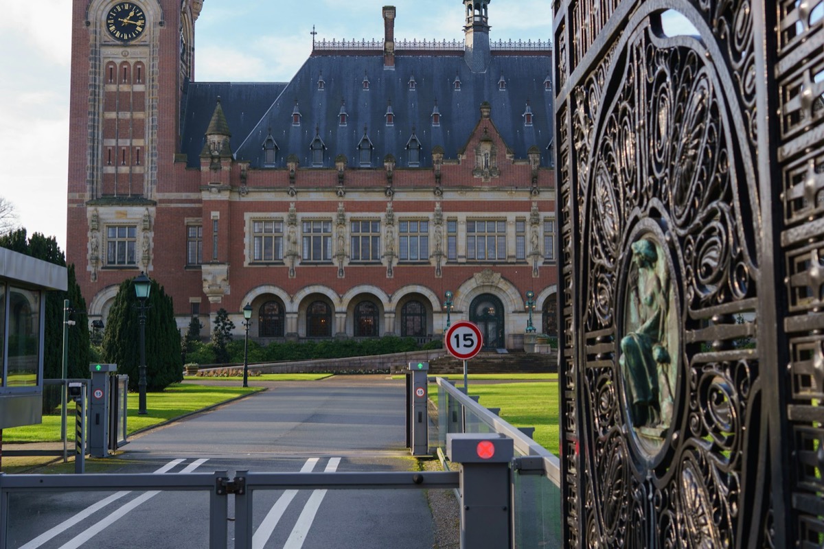 Ornate gate in front of a grand historic building