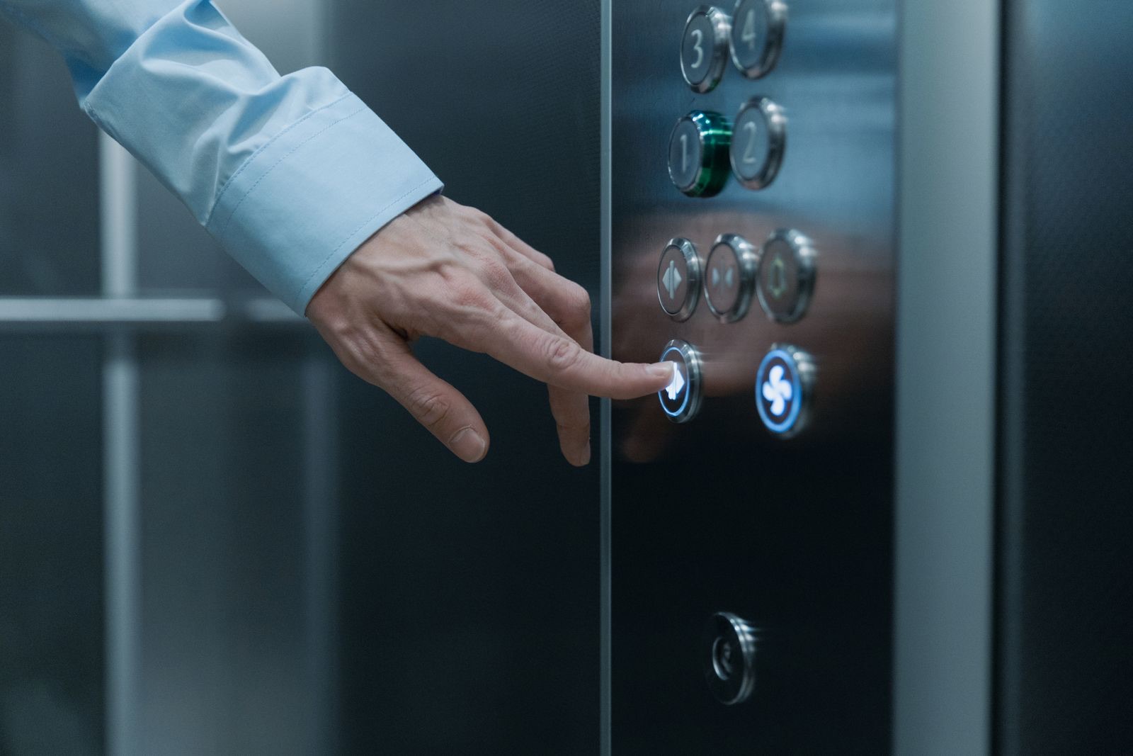 Pressing an elevator button
