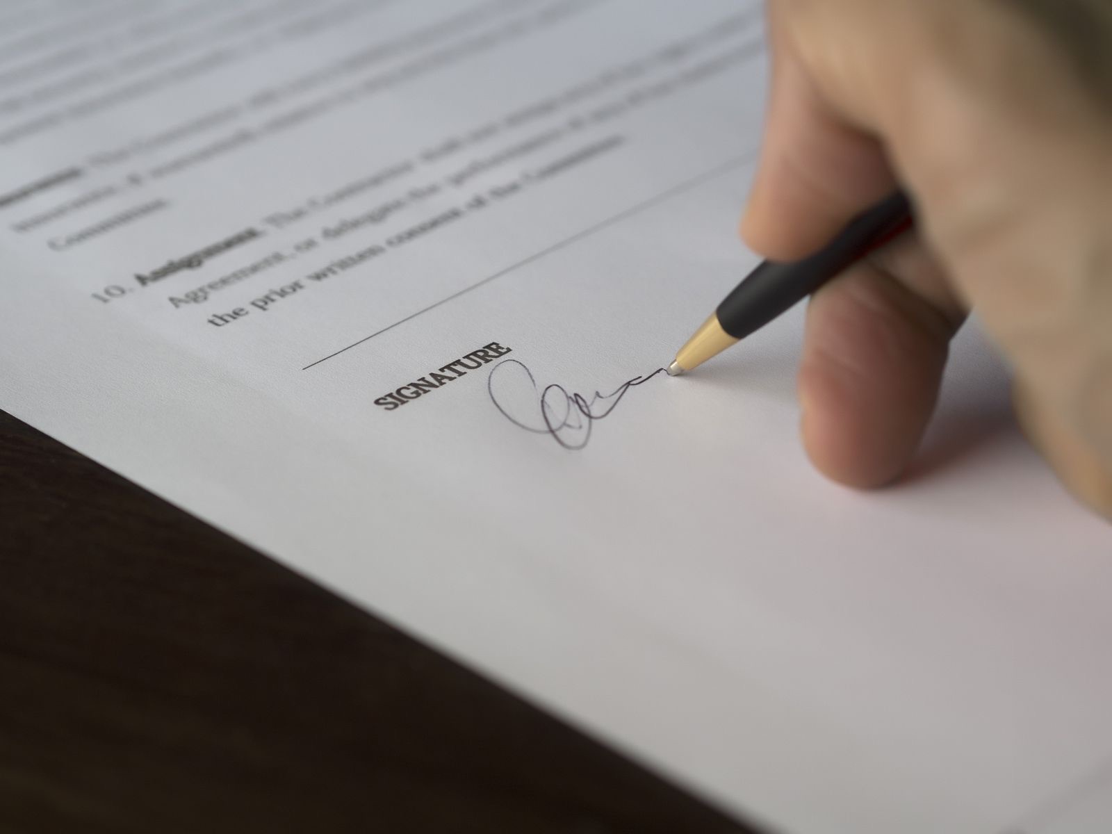 Signing a contract with a pen